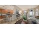 Kitchen features light wood cabinets, granite countertops, and stainless steel appliances at 872 Clear Lake Dr, Englewood, FL 34223