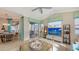 Spacious living area showcasing a large TV and comfortable seating at 872 Clear Lake Dr, Englewood, FL 34223