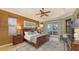 Serene main bedroom with a king-size bed and access to a patio at 872 Clear Lake Dr, Englewood, FL 34223
