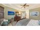 Comfortable main bedroom with a king-size bed and sitting area at 872 Clear Lake Dr, Englewood, FL 34223