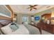 Spacious main bedroom with a king-size bed and a large dresser at 872 Clear Lake Dr, Englewood, FL 34223