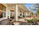 Relaxing patio with seating area, hot tub, and lush landscaping at 872 Clear Lake Dr, Englewood, FL 34223