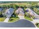 Luxury home community with lush landscaping and a tranquil lake at 8808 Enclave Ct, Sarasota, FL 34238