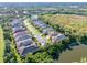 Expansive aerial view of a residential neighborhood near a lake at 8808 Enclave Ct, Sarasota, FL 34238