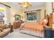 Spacious bedroom with wood furniture and large windows at 8808 Enclave Ct, Sarasota, FL 34238