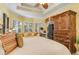 Main bedroom with large windows and a wooden armoire at 8808 Enclave Ct, Sarasota, FL 34238
