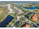 Aerial view of community featuring water features and numerous homes at 8808 Enclave Ct, Sarasota, FL 34238