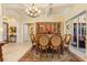 Elegant dining room with chandelier and wood table at 8808 Enclave Ct, Sarasota, FL 34238