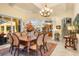 Formal dining room with large table and access to patio at 8808 Enclave Ct, Sarasota, FL 34238