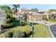 Beautiful two-story home with three car garage and lush landscaping at 8808 Enclave Ct, Sarasota, FL 34238