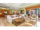 Comfortable living room with white sofa and wood coffee table at 8808 Enclave Ct, Sarasota, FL 34238