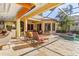 Tranquil pool and patio with access from the interior living space at 8808 Enclave Ct, Sarasota, FL 34238