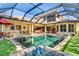 Relaxing pool and spa with covered patio and outdoor kitchen at 8808 Enclave Ct, Sarasota, FL 34238