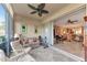 Sunroom opens to living area with piano and access to lanai at 9480 High Gate Dr # 2111, Sarasota, FL 34238