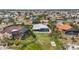 Aerial view showcasing multiple luxurious waterfront homes with pools and large yards at 103 Graham Se St, Port Charlotte, FL 33952