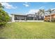 Landscaped backyard of home with water view at 103 Graham Se St, Port Charlotte, FL 33952