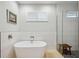 Bathroom featuring a soaking tub and walk-in shower at 103 Graham Se St, Port Charlotte, FL 33952