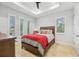 Bedroom with wood bed frame and red bedding at 103 Graham Se St, Port Charlotte, FL 33952