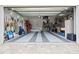 Spacious garage with overhead storage and epoxy floor at 103 Graham Se St, Port Charlotte, FL 33952