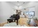 Elegant music room with a grand piano and access to living room at 103 Graham Se St, Port Charlotte, FL 33952