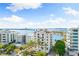 Aerial view of waterfront property and surrounding buildings at 111 Golden Gate Pt # 701Ph, Sarasota, FL 34236