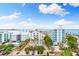 Aerial view showcasing the building and surrounding area at 111 Golden Gate Pt # 701Ph, Sarasota, FL 34236