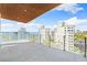 Spacious balcony with water and city views at 111 Golden Gate Pt # 701Ph, Sarasota, FL 34236