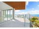 Spacious balcony with water views and city skyline at 111 Golden Gate Pt # 701Ph, Sarasota, FL 34236