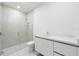 Modern bathroom with a frameless shower and white vanity at 111 Golden Gate Pt # 701Ph, Sarasota, FL 34236