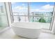 Relaxing bathroom with freestanding tub and water views at 111 Golden Gate Pt # 701Ph, Sarasota, FL 34236