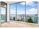 Light-filled bedroom, hardwood floors and water views at 111 Golden Gate Pt # 701Ph, Sarasota, FL 34236