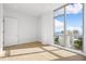 Bright bedroom with hardwood floors and water views at 111 Golden Gate Pt # 701Ph, Sarasota, FL 34236