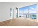 Bright bedroom with hardwood floors and stunning water views at 111 Golden Gate Pt # 701Ph, Sarasota, FL 34236