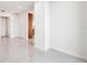 Spacious hallway with light walls and tile flooring at 111 Golden Gate Pt # 701Ph, Sarasota, FL 34236