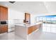 Modern kitchen with island and high-end appliances at 111 Golden Gate Pt # 701Ph, Sarasota, FL 34236