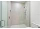 Modern shower with glass enclosure and neutral tile at 111 Golden Gate Pt # 701Ph, Sarasota, FL 34236