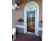 Attractive front entry with arched top and glass door at 114 Wilmers Rd, Punta Gorda, FL 33982