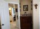 A hallway with access to a bathroom and linen closet at 114 Wilmers Rd, Punta Gorda, FL 33982