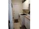 Laundry room with washer, dryer, and extra storage at 114 Wilmers Rd, Punta Gorda, FL 33982