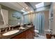 Bathroom with double vanity and shower/tub combo at 1225 S View Dr, Sarasota, FL 34242