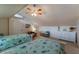 Bedroom with twin beds and seating area at 1225 S View Dr, Sarasota, FL 34242