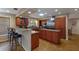 Kitchen with granite countertops, wood cabinets, and breakfast bar at 1225 S View Dr, Sarasota, FL 34242