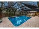 Enjoy this refreshing pool with a screened enclosure at 1225 S View Dr, Sarasota, FL 34242