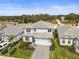 Two-story house with gray roof, driveway, and landscaping at 12409 Wigeon Dr, Bradenton, FL 34212