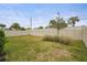 Grass yard with a vinyl fence, offering privacy and space at 12409 Wigeon Dr, Bradenton, FL 34212