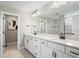 Double vanity bathroom with white cabinets and quartz countertops at 12409 Wigeon Dr, Bradenton, FL 34212