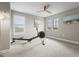 Home gym with rowing machine and window with shutters at 12409 Wigeon Dr, Bradenton, FL 34212