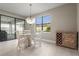 Bright dining area with a glass-top table and white chairs at 12409 Wigeon Dr, Bradenton, FL 34212