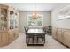 Elegant dining room with wood table and chandelier at 12409 Wigeon Dr, Bradenton, FL 34212