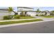 Two-story house with a grassy lawn and palm trees at 12409 Wigeon Dr, Bradenton, FL 34212